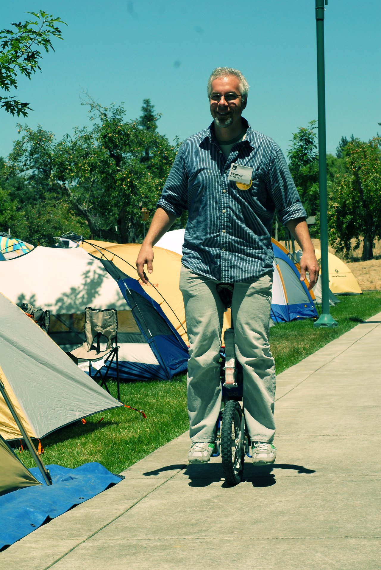 Trevor Blackwell riding his self-balancing electric unicycle outdoors at Foo Camp in 2007