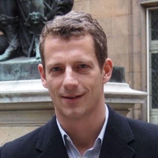 Archival photograph of Trevor Kaufman outdoors, used in his 2025 presentation about newspaper revenue