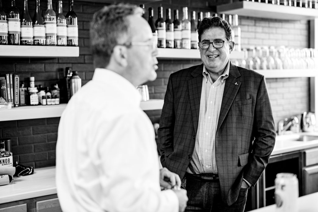 Two Triad Strategies colleagues talking in the firm's Harrisburg gathering space