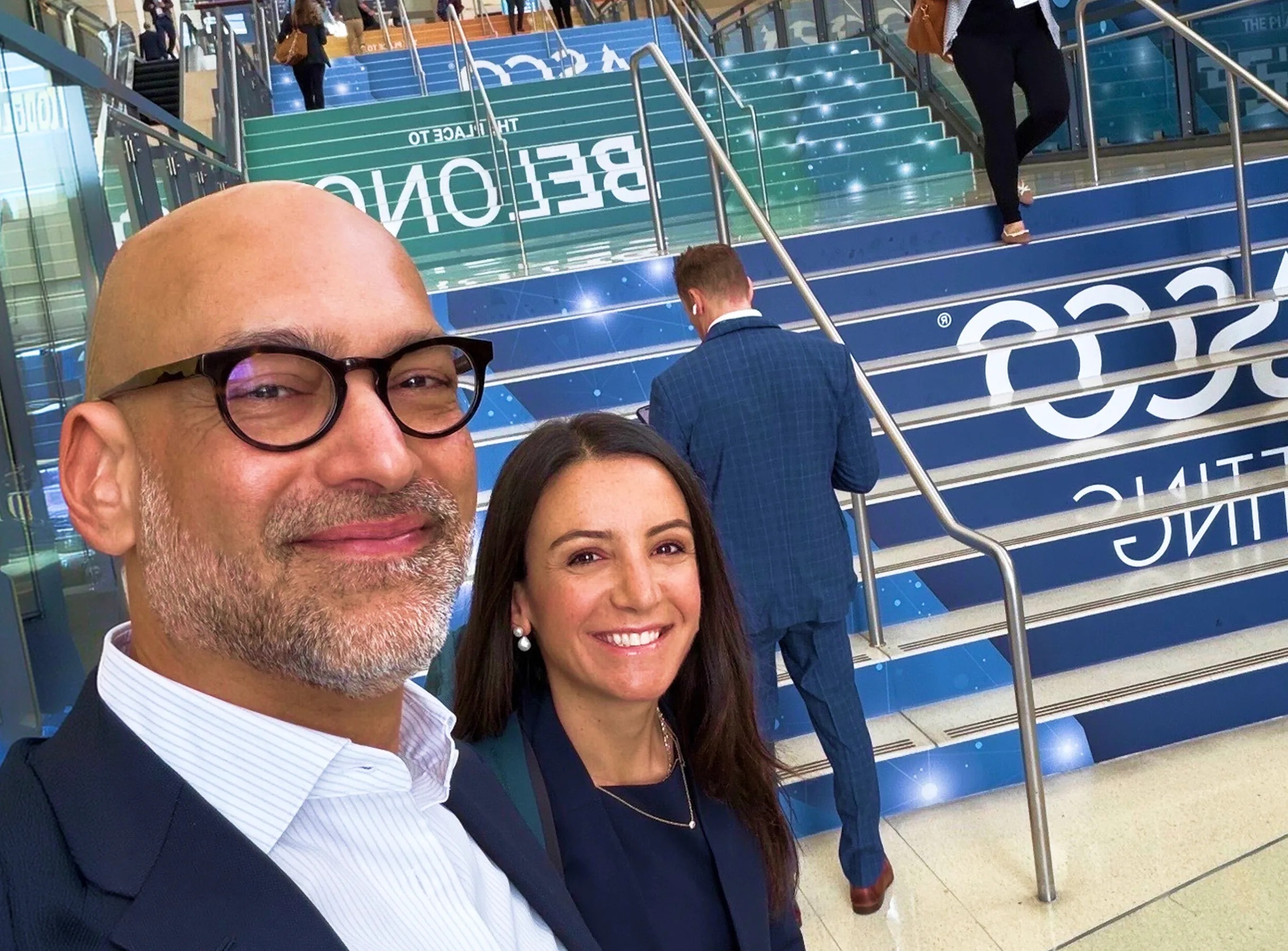 Trial Library chief product officer Karim Damji and founder Hala Borno at an ASCO conference