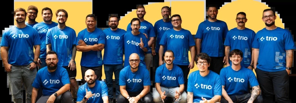 Trio team members wearing matching blue company shirts