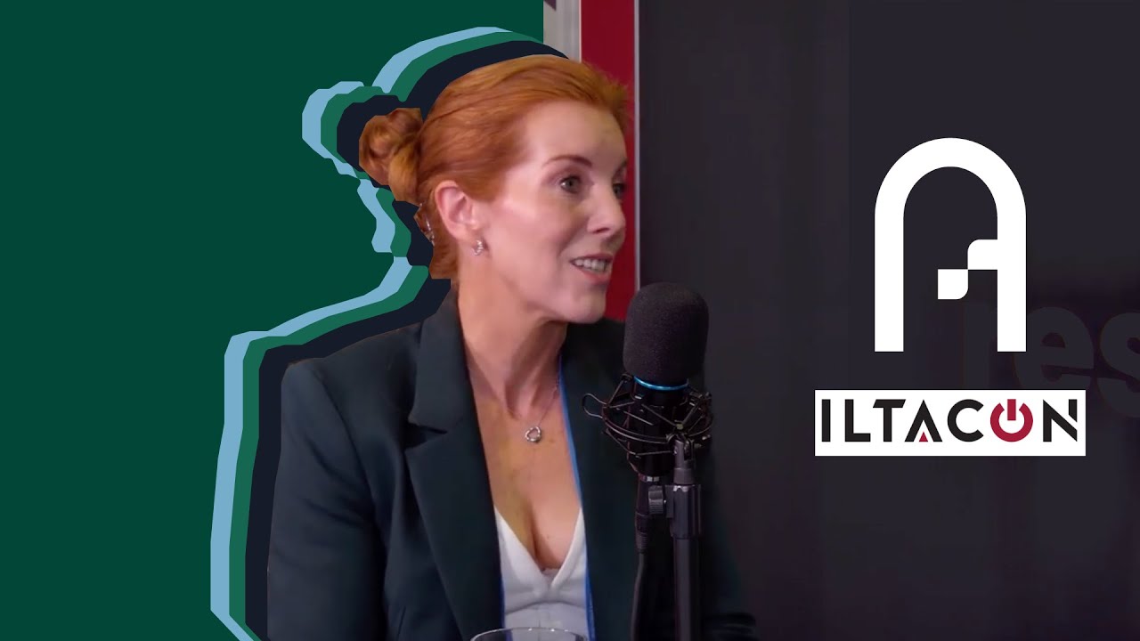 Triona Buckley speaking into a microphone during an ILTACON interview