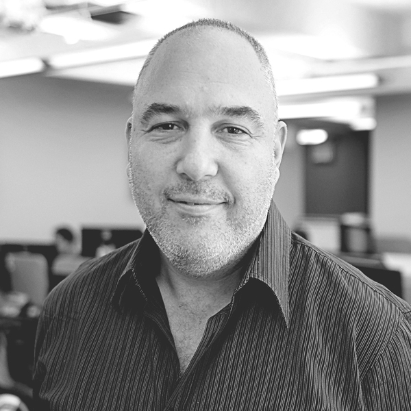 Black-and-white portrait of TriPlay founder Tamir Koch
