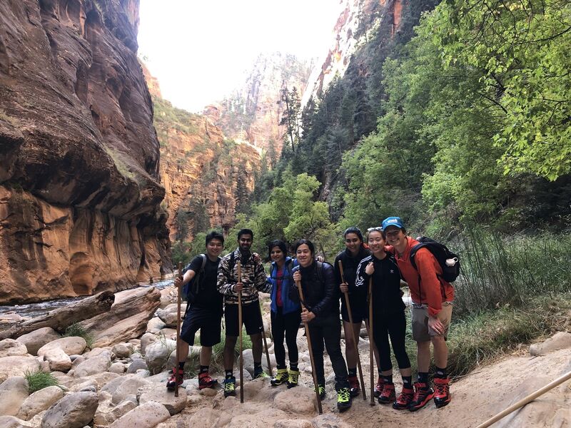 Early Unit21 team with hiking poles in a rocky canyon at Zion National Park