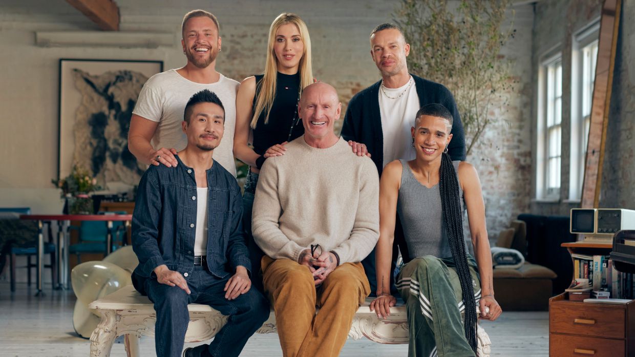 Tristan Pineiro seated at right with a group of marketing leaders in a loft setting