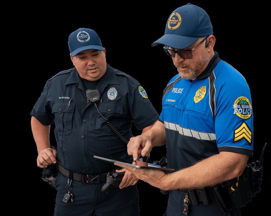 Two uniformed police officers consult a tablet in a CentralSquare promotional photograph