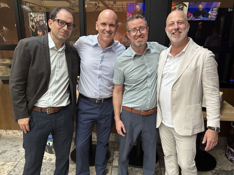 Godin Productions executive leaders standing together at a company gathering