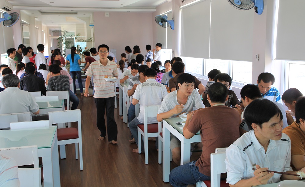 AgilityIO Vietnam team members sharing lunch in the company cafeteria