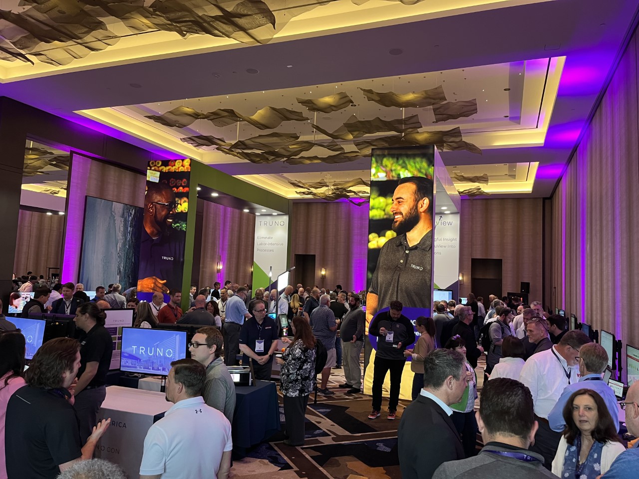 Retail technology attendees and displays at a TRUNO partner showcase