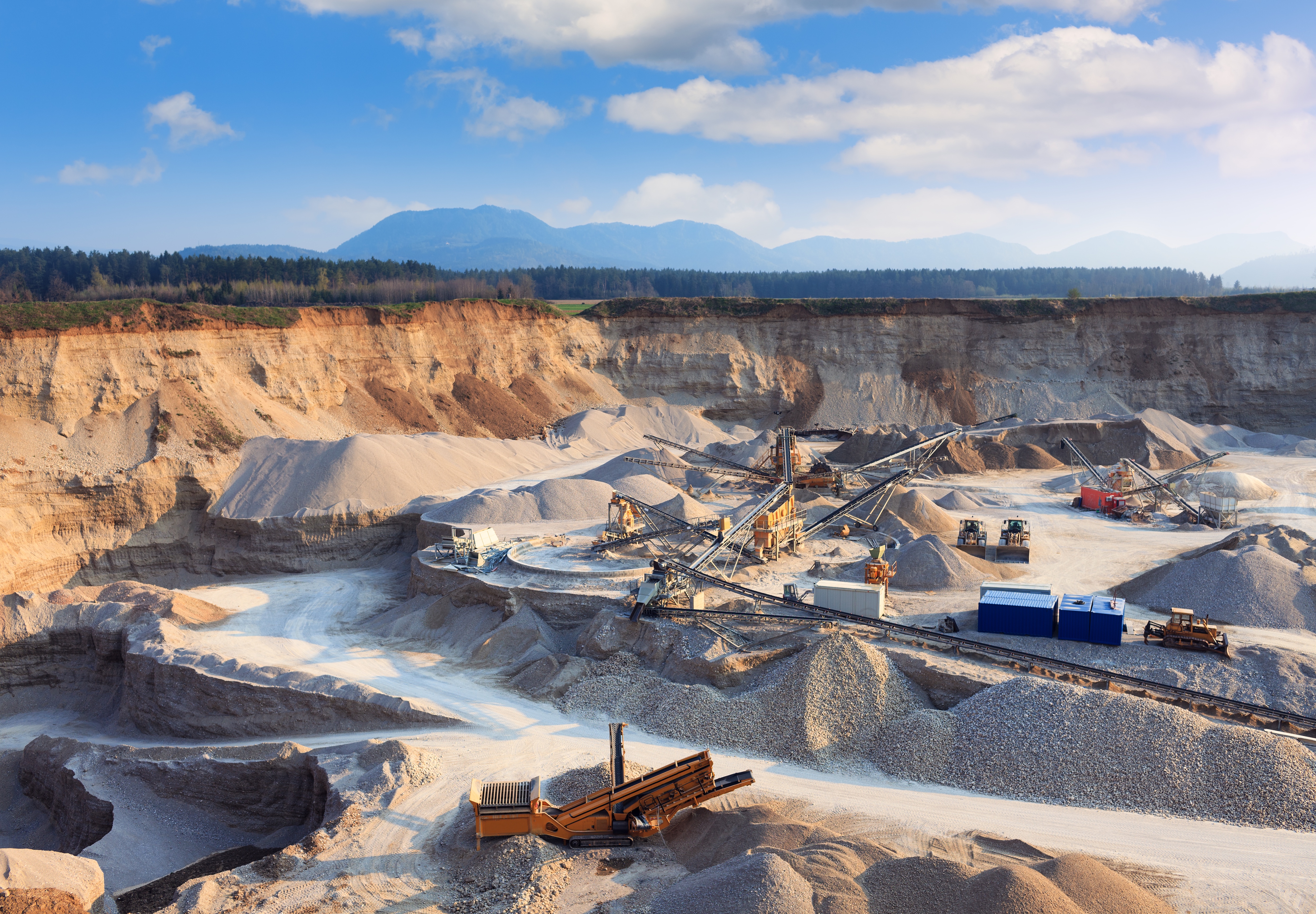 Construction material production site with heavy equipment