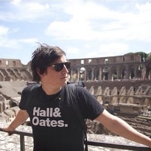 Pathlight co-founder and CTO Trey Doig wearing sunglasses and a Hall & Oates T-shirt