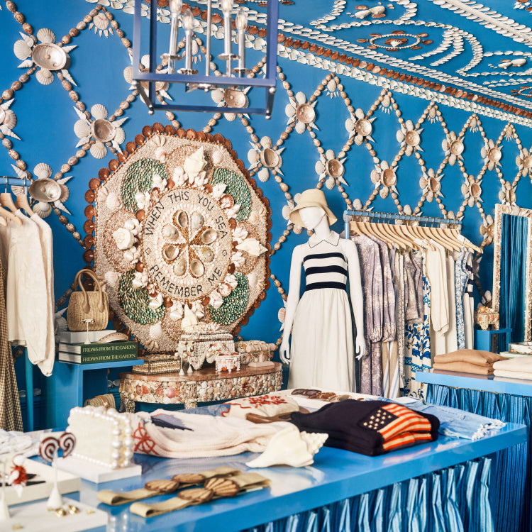 Shell-covered blue walls and ceiling above clothing and gifts in Tuckernuck’s Nantucket store