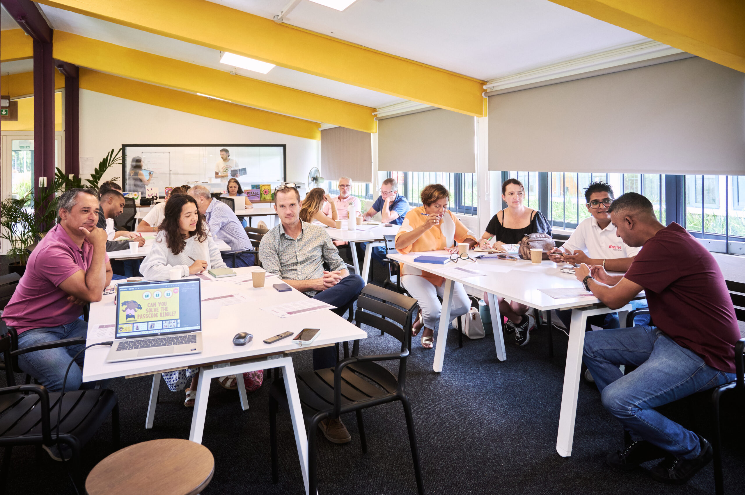Participants seated around tables during a Turbine workshop
