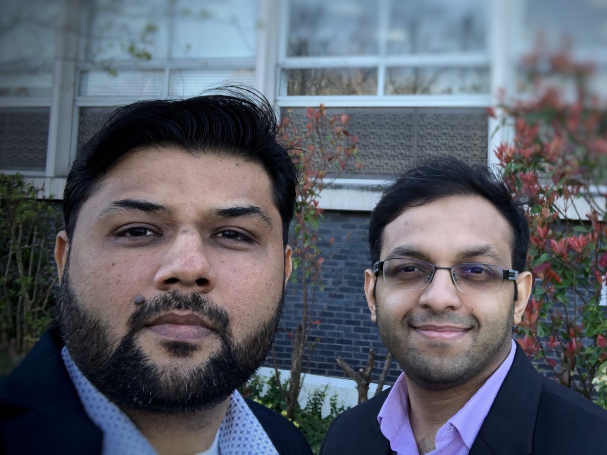 Turing Labs founders Manmit Shrimali and Ajith Govind standing outdoors