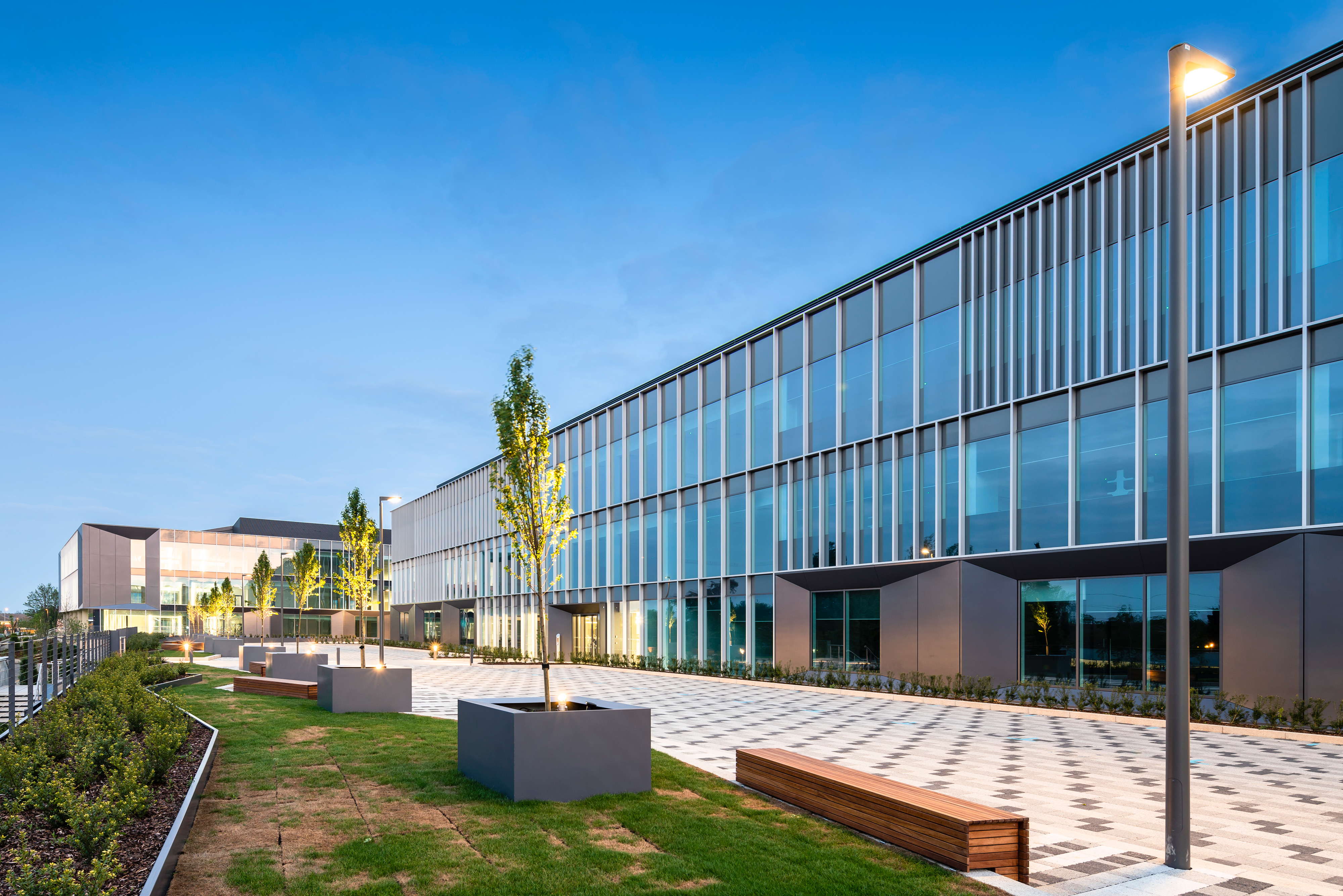 Contemporary TusPark Cambridge buildings beside a landscaped pedestrian courtyard