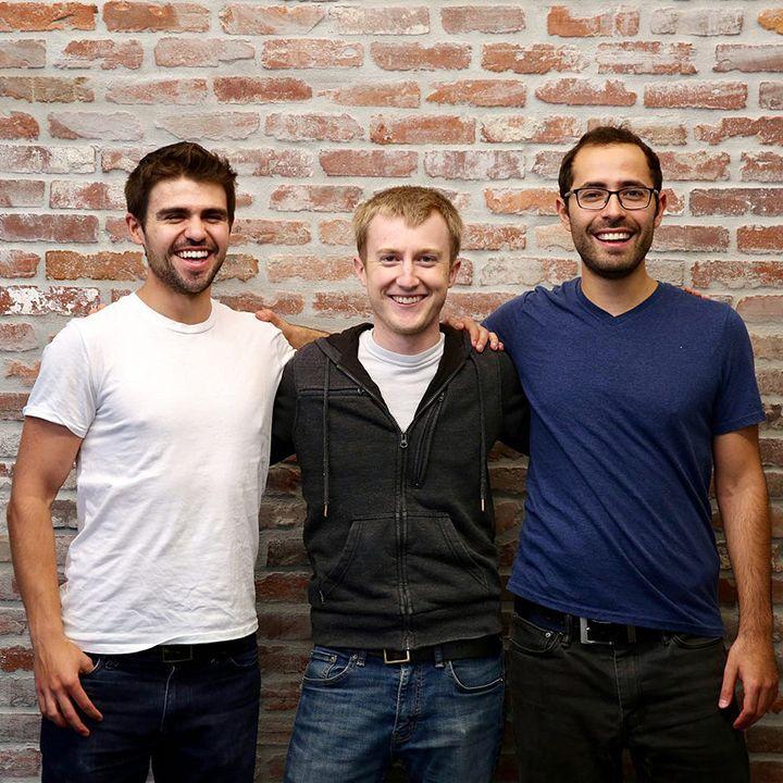 Three Segment co-founders standing together in front of a brick wall