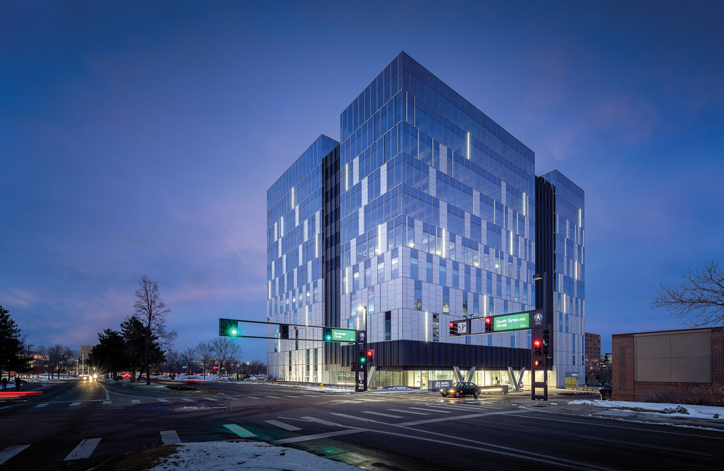 The glass exterior of the 50 Fifty building in Denver