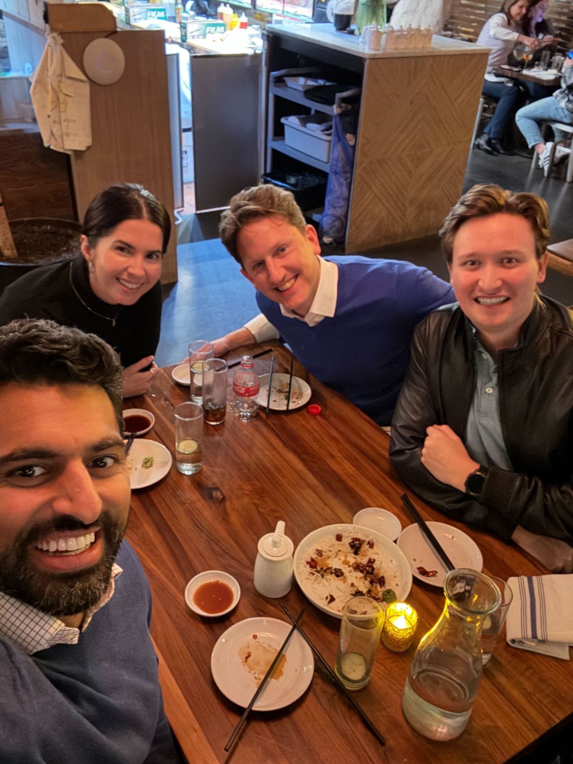 Brydon colleagues gathered around a restaurant table during a Chicago visit