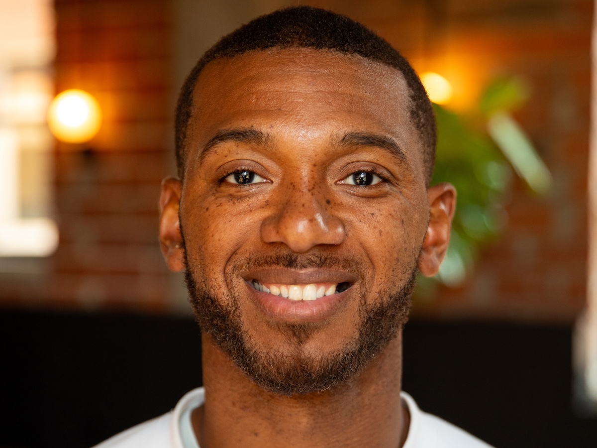 Tyrre Burks smiling in a press photograph