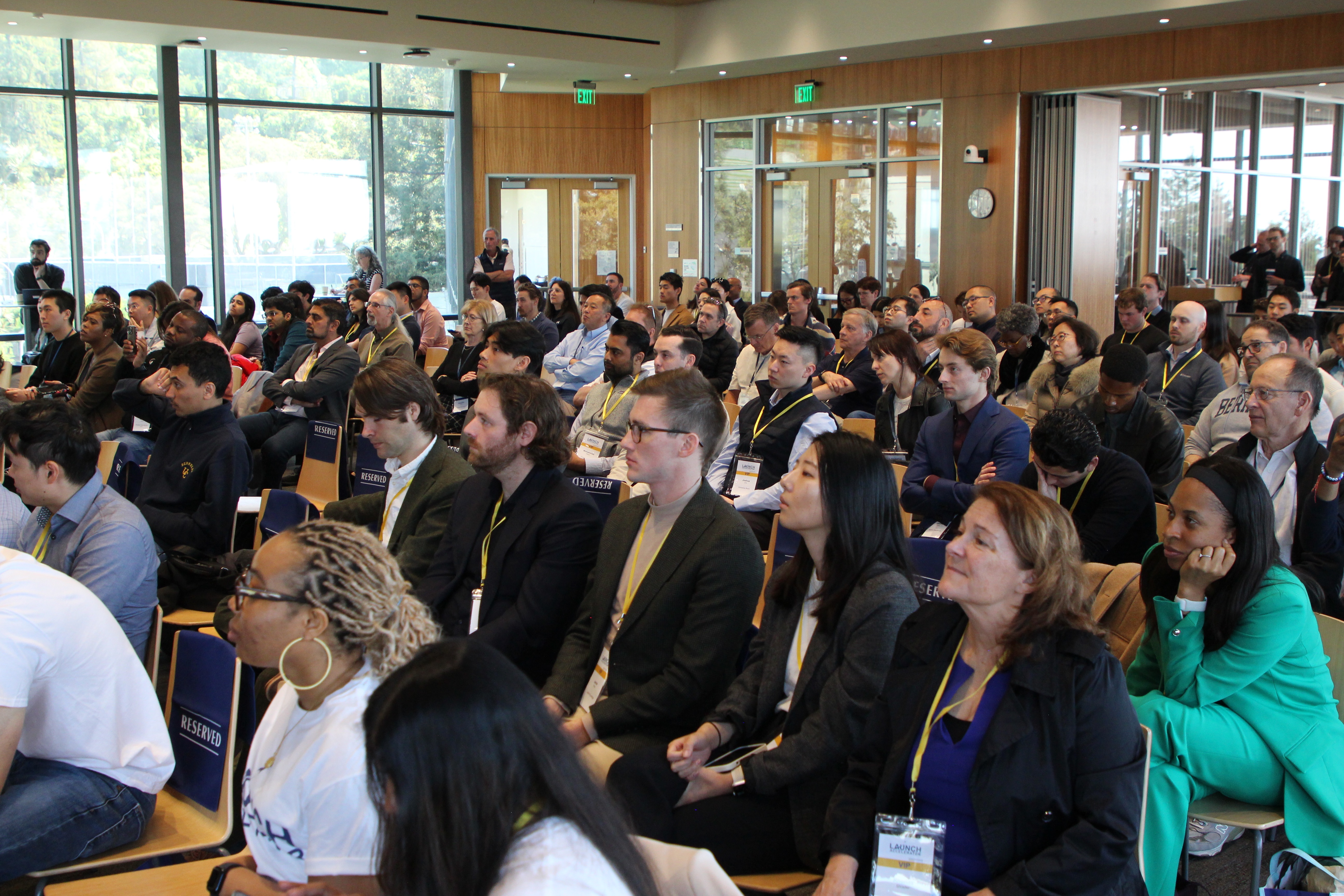 An audience wearing LAUNCH badges listens during an event at Berkeley Haas