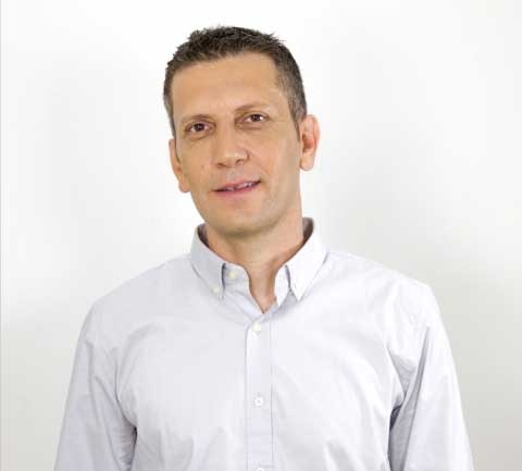 Udi Dor in a white shirt, in the portrait accompanying his radio-frequency engineering biography