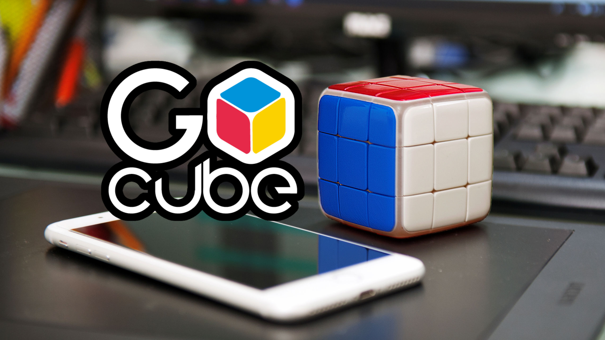 A GoCube beside a phone, photographed for the 2018 GenXGrownUp interview
