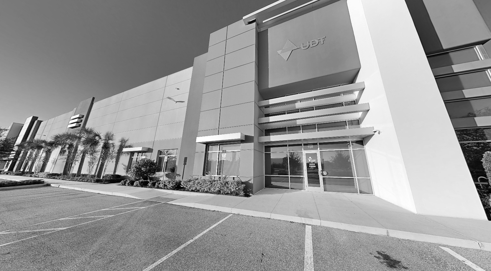 Exterior of a UDT integration center, with its entrance and loading-area building