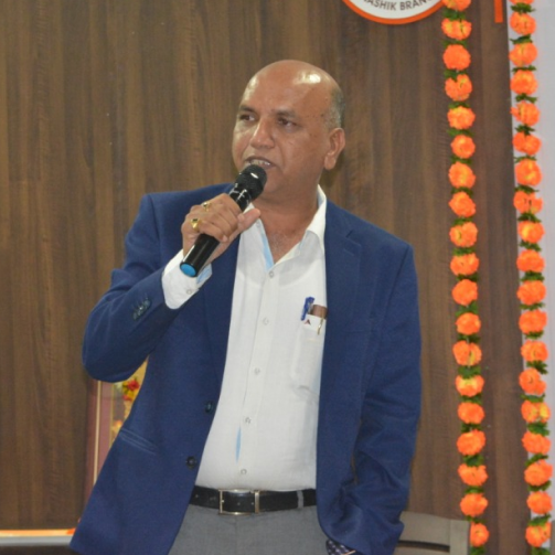 Udyogwardhini founder Sunil Chandak speaking into a microphone