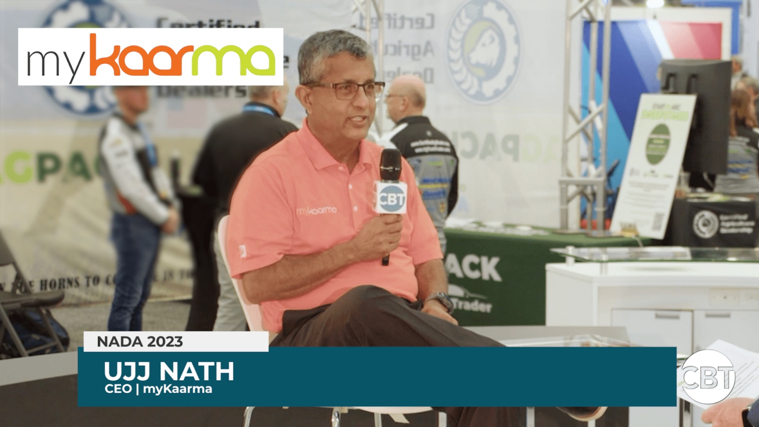 Ujj Nath holding a CBT News microphone during an interview at NADA 2023