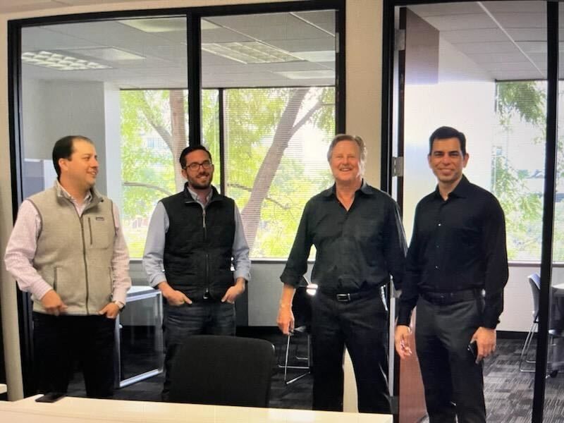 Ulf Sandberg standing with three KlearNow colleagues in an office