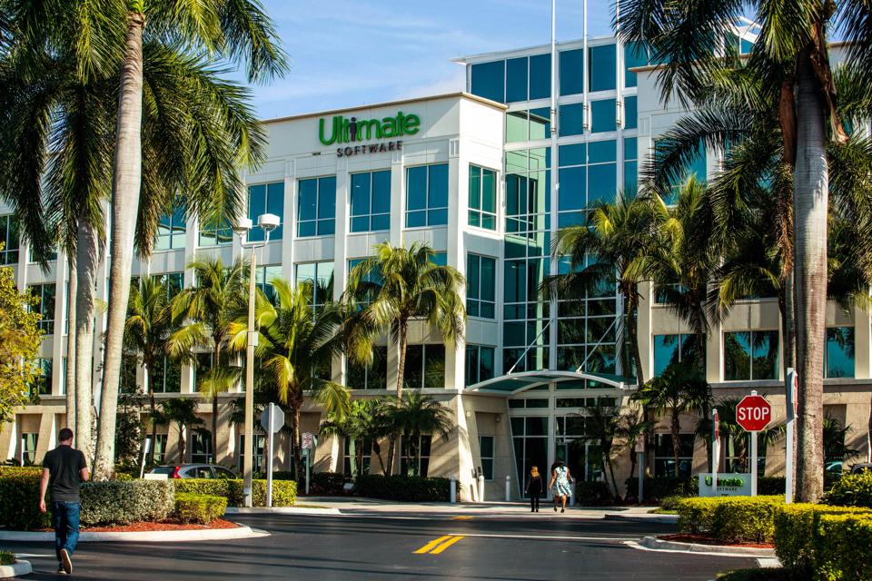 Ultimate Software’s historical Weston office surrounded by palms