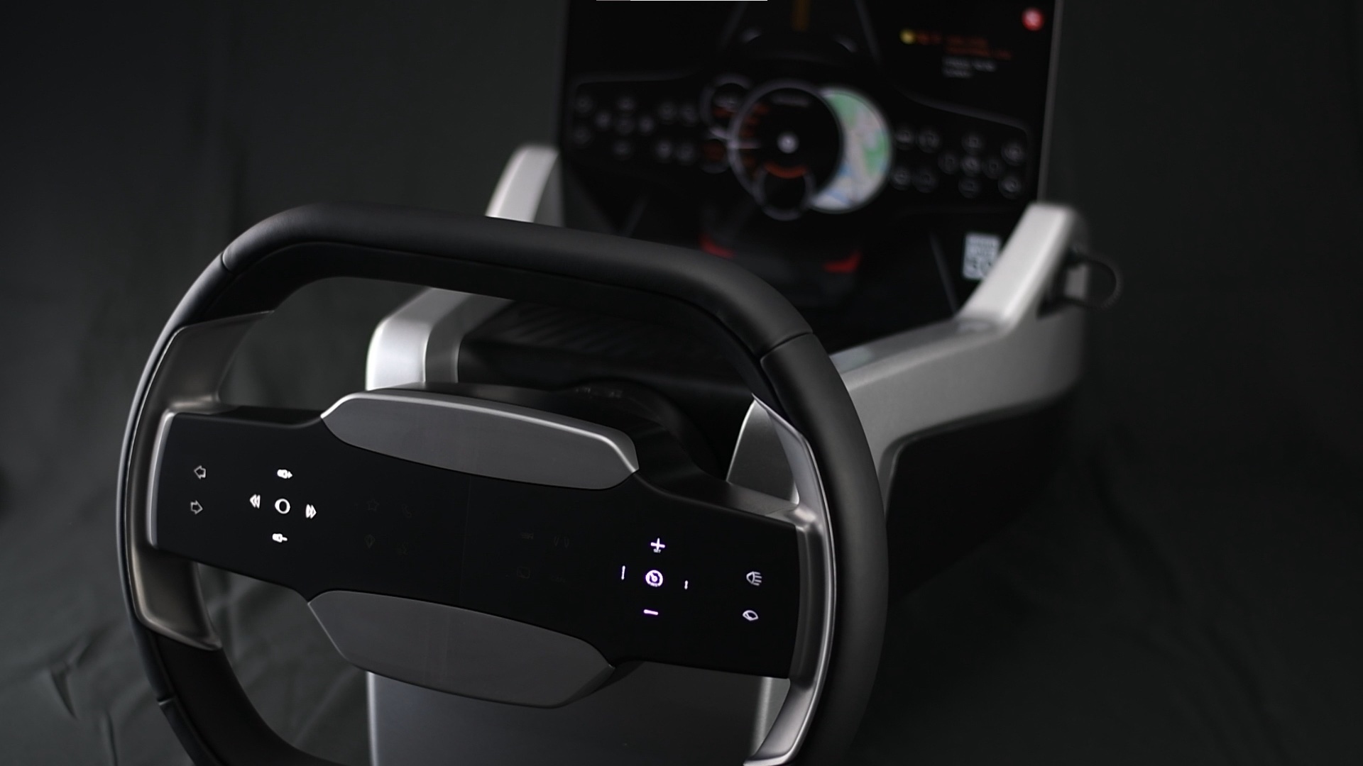 Prototype steering wheel with illuminated touch controls across its center