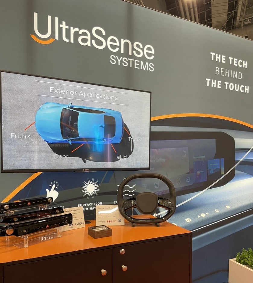 UltraSense CES display showing automotive smart-surface applications and prototypes