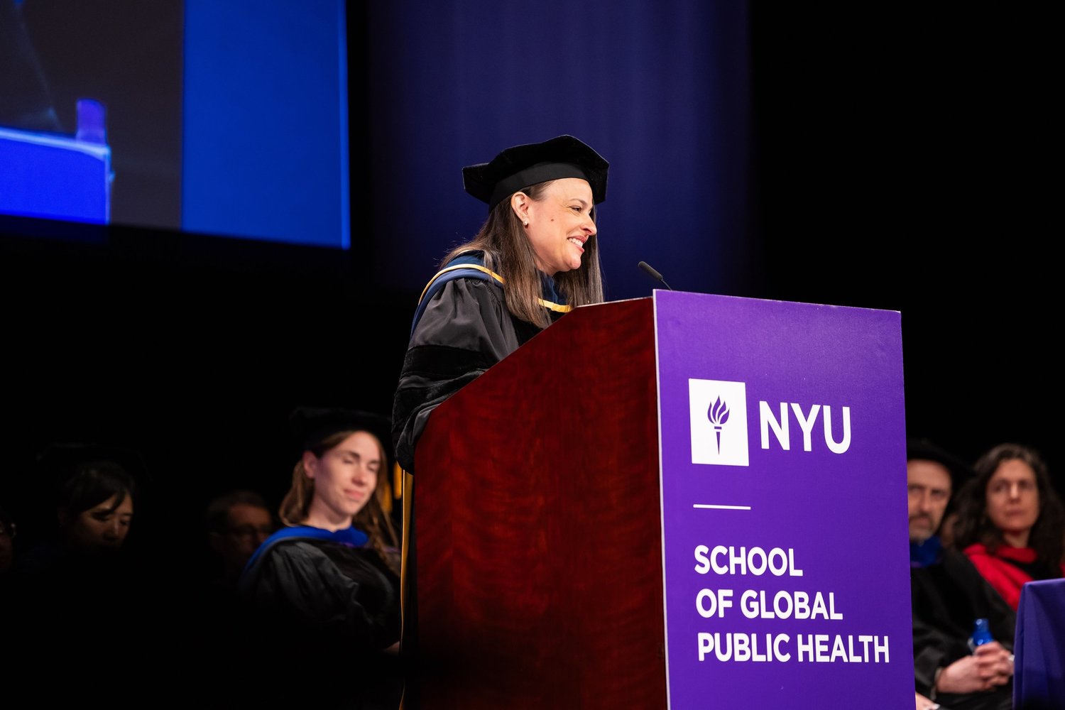 Jess Steier speaking at the NYU School of Global Public Health commencement in 2026