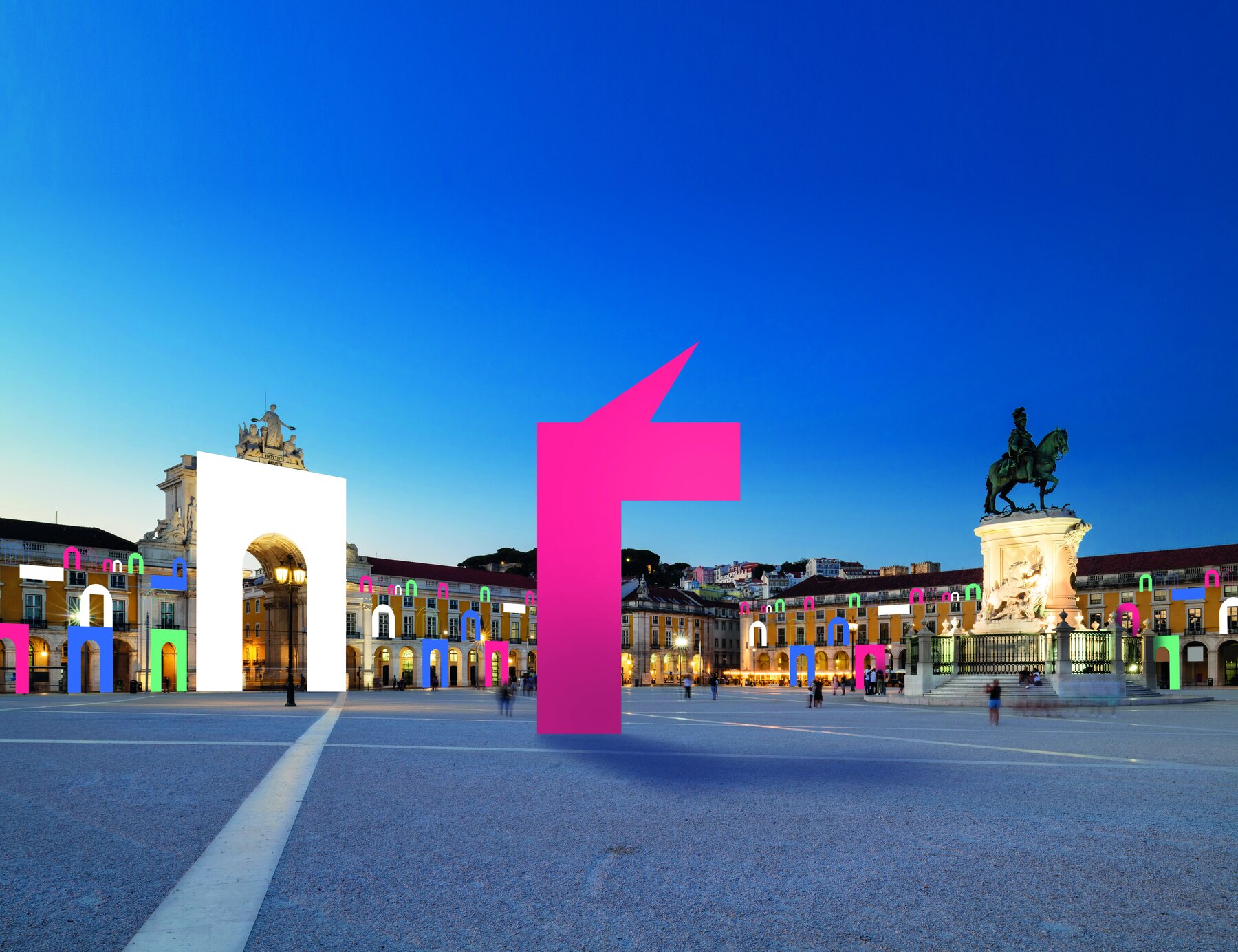 Lisbon's Praça do Comércio overlaid with colorful Unicorn Factory arches
