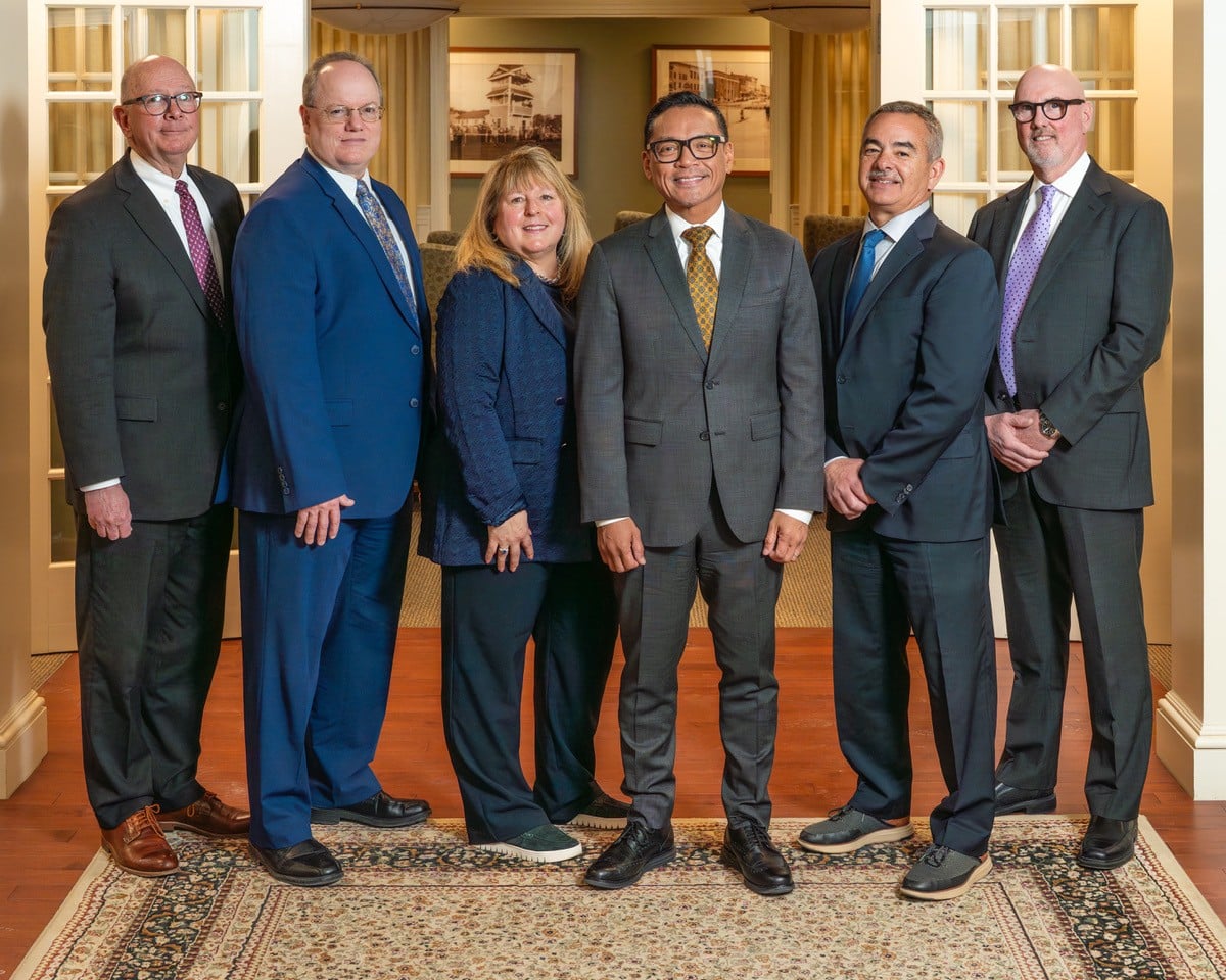 Union Savings Bank’s six-member leadership team standing together indoors