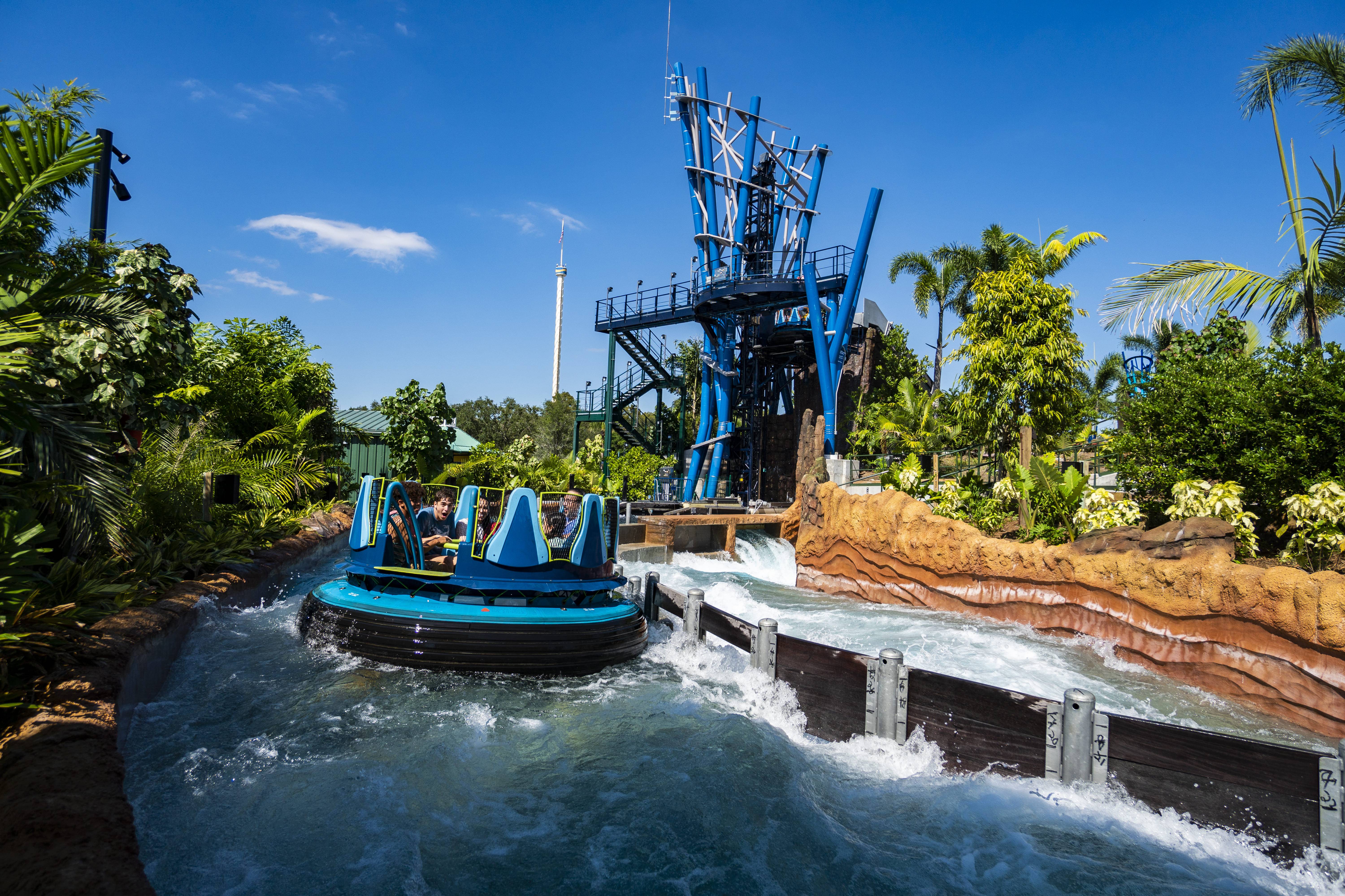 Riders aboard a circular raft on Infinity Falls at SeaWorld Orlando