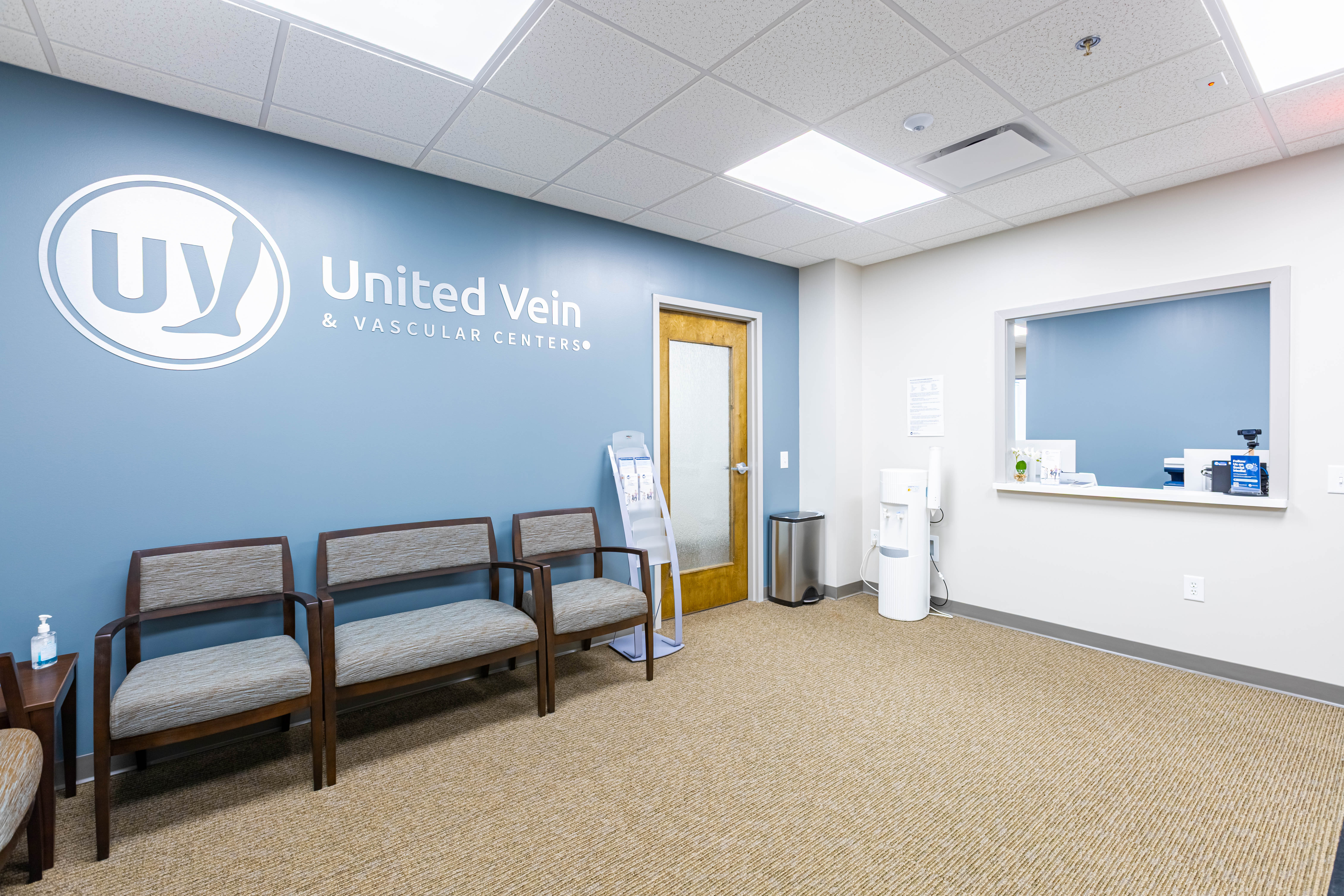 A branded United Vein & Vascular Centers clinic waiting room