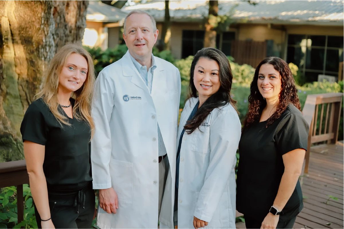 A United Vein clinic team standing together outdoors