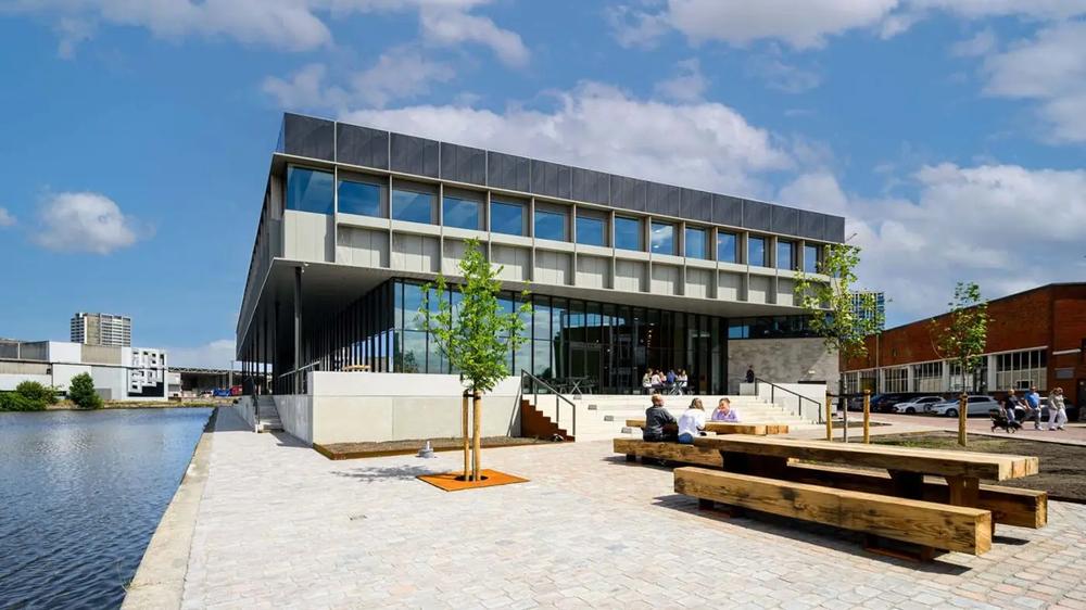 Titaan's waterfront building and shared outdoor seating in The Hague