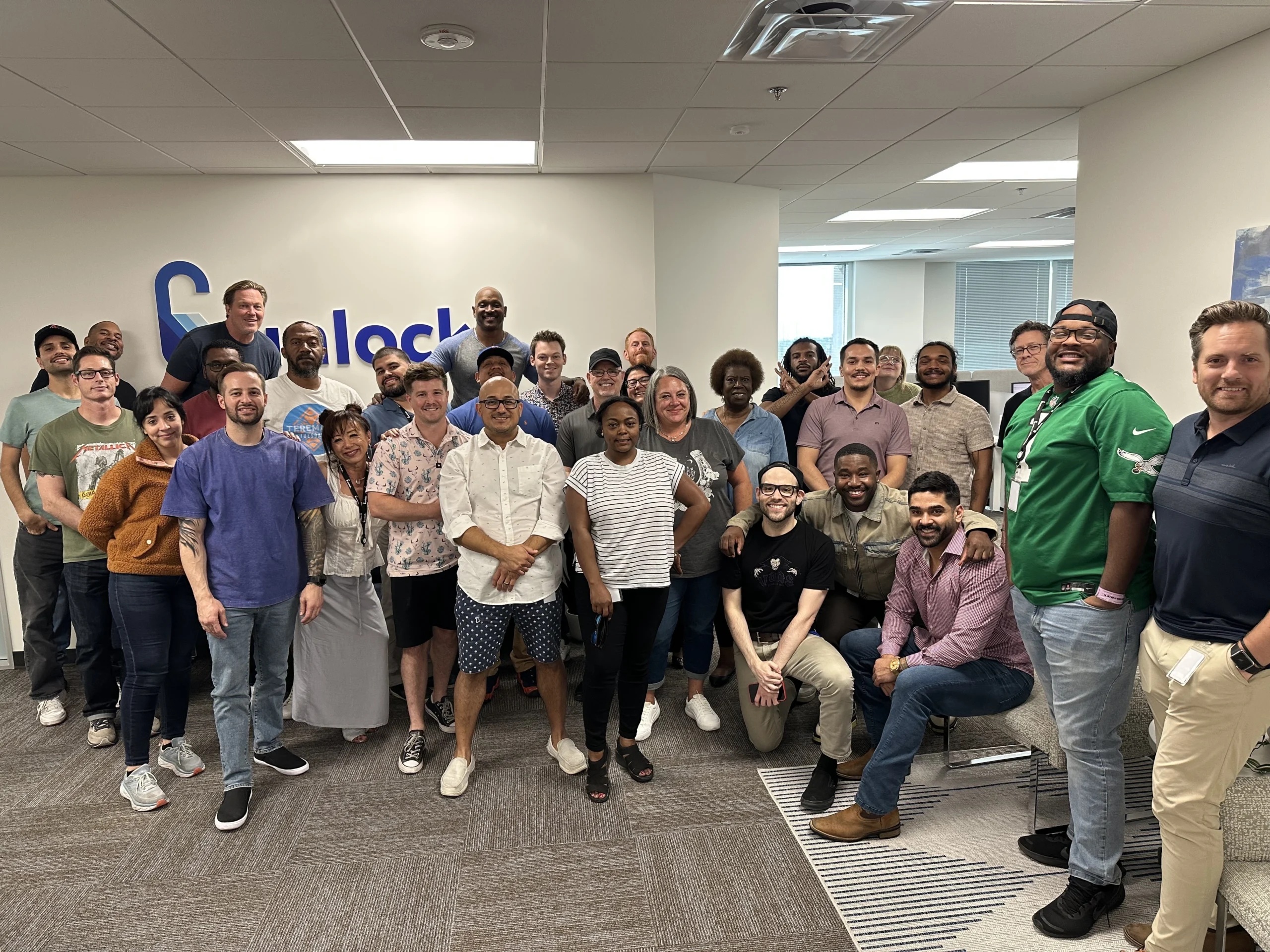 Members of the Unlock team gathered in an office