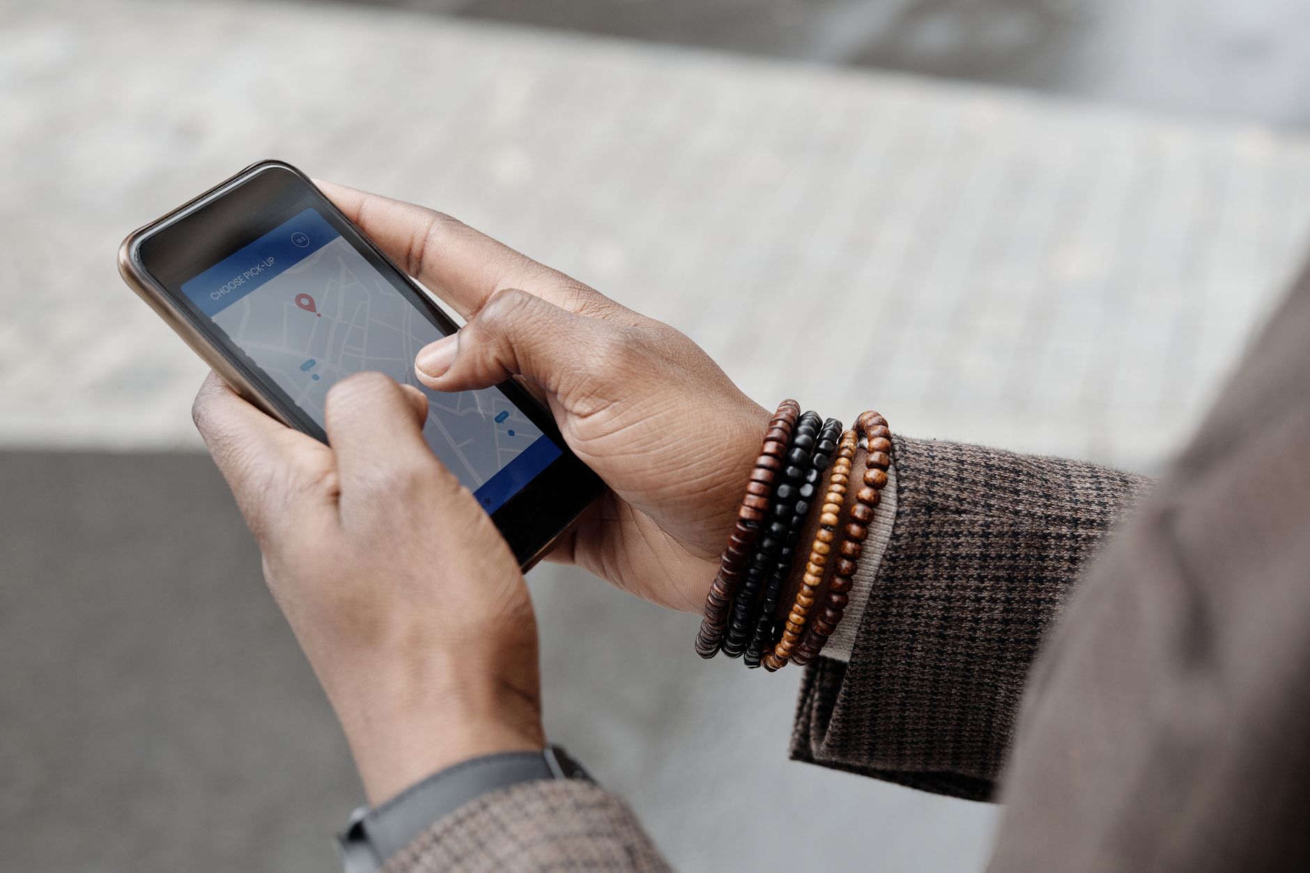 A person using a location map on a smartphone