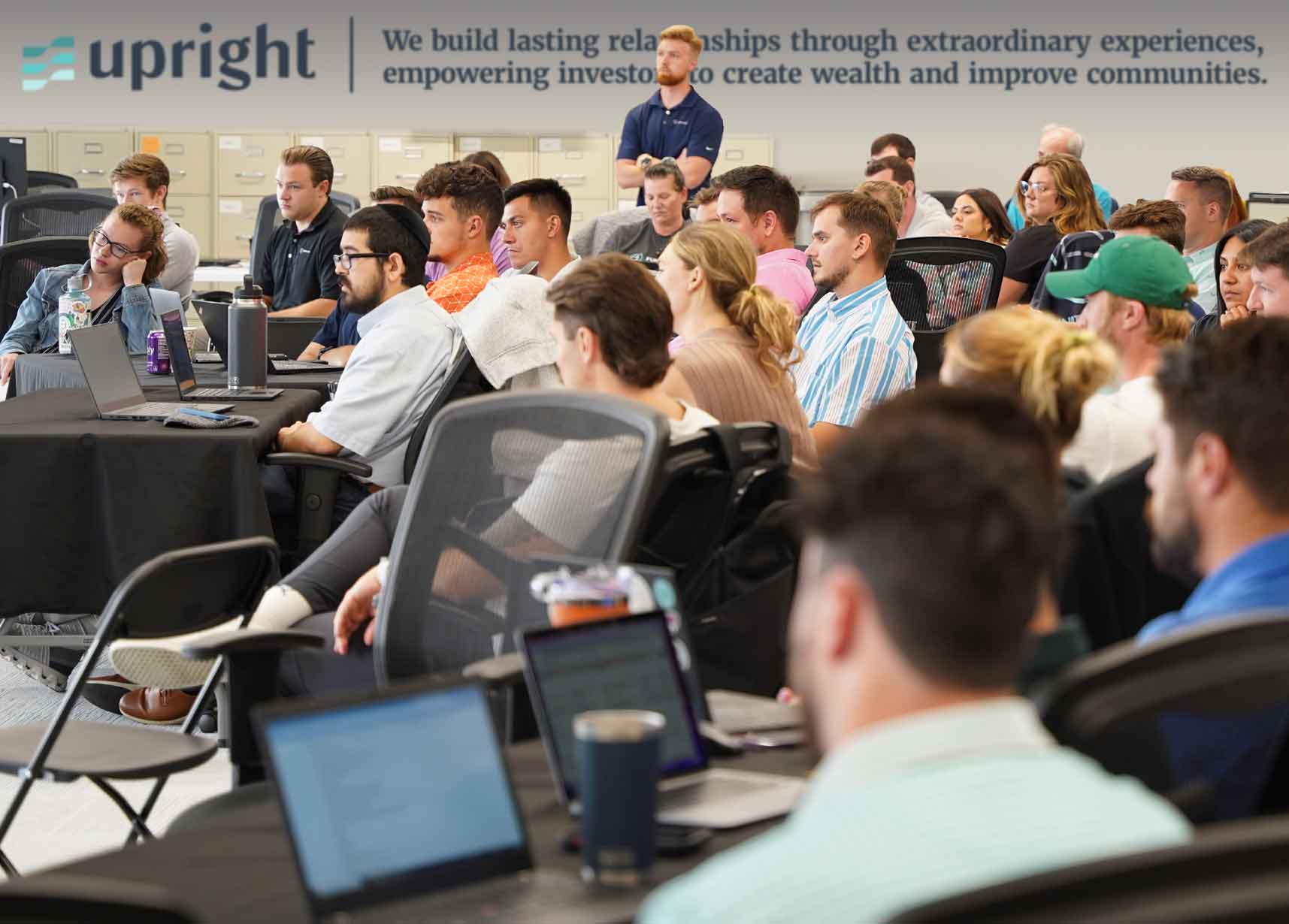 Members of the Upright team gathered in a bright office