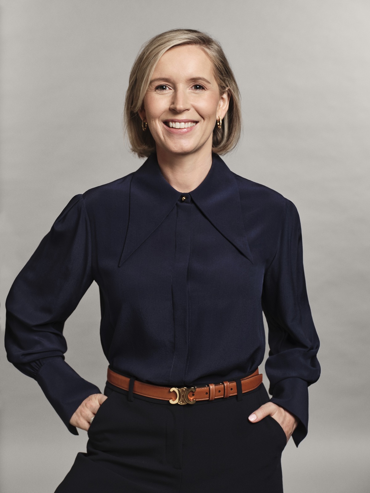 Upwork president and CEO Hayden Brown, wearing a navy shirt, in an official company portrait