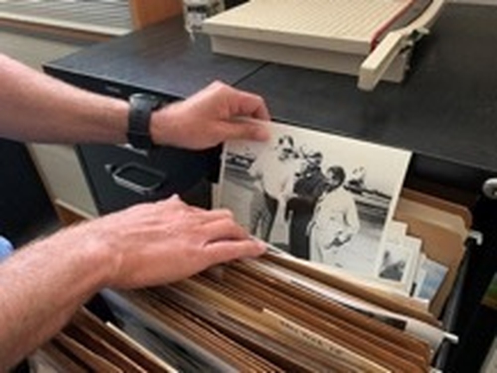 Marine Corps officer Matthew Hilton shows historical photographs during a production at Camp Pendleton