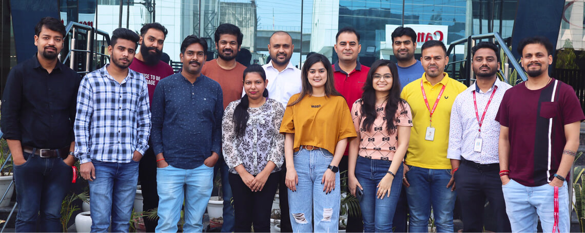 UVdesk team members standing together outside a building