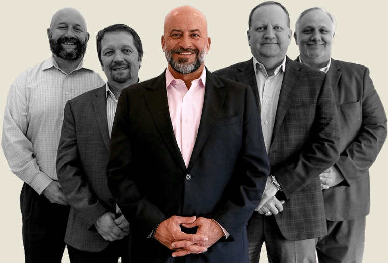 Company-provided composite of Voice Media Group leaders, with Scott Tobias at the center