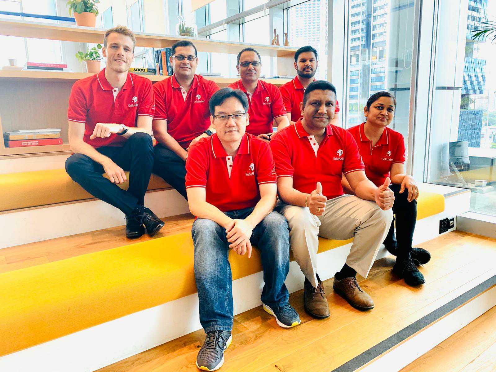 Vaibhav Dabhade, second from left in the back row, with Anchanto colleagues wearing red SelluSeller shirts