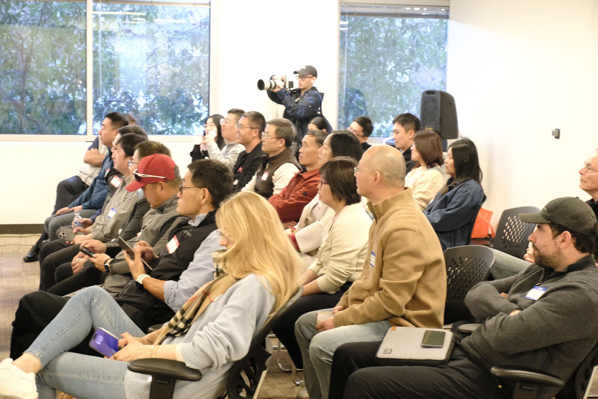 Audience seated together at an event pictured on Valkyrie Fund’s incubator website