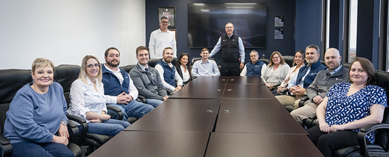Valor team members gathered around a conference table